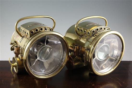 A pair of Bleriot of Paris brass bullseye motoring lamps, height 11in.